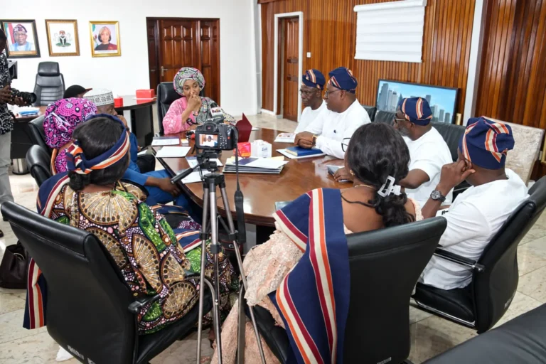 Foundation delegation meeting with officials, with press in attendance